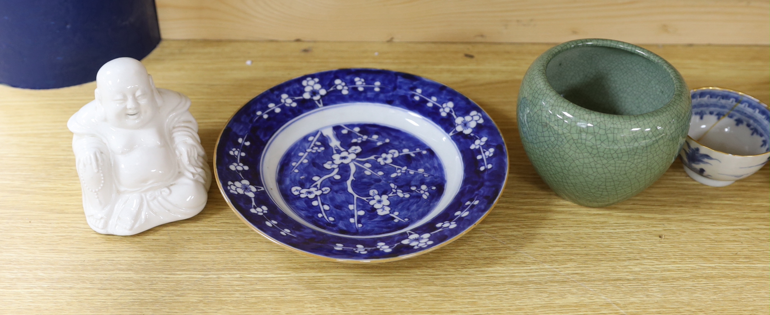 Two Chinese export plates, a prunus dish, tea bowl and cup, a crackleware bowl and a Buddha, widest plate 23cm diameter (7)